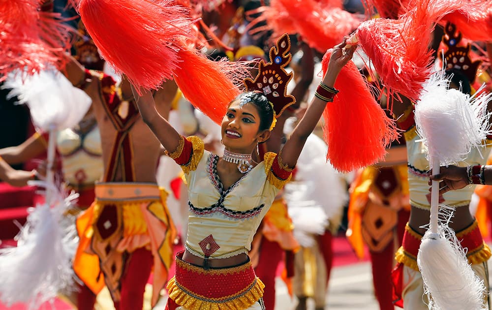 Sri Lankan traditional dancers perform during a parade celebrating Sri Lanka`s 66th Independence Day, marking the country`s independence from British colonial rule in 1948, in Kegalle, about 80 kilometers (50 miles) northeast of Colombo, Sri Lanka.