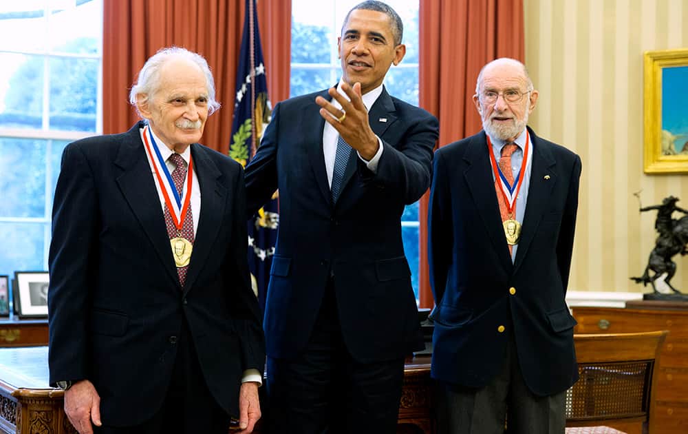 President Barack Obama meets with recipients of the 2013 Fermi Award, scientists Allen Bard, left and Andrew Sessler, in the Oval Office of the White House in Washington.