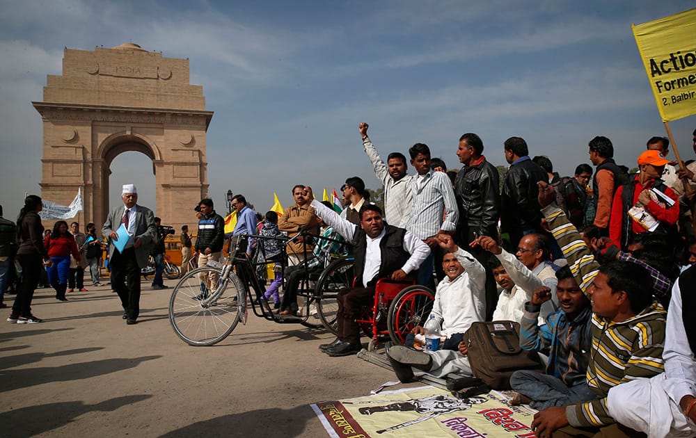Hundreds of disabled men and women stage a protest rally at India Gate to urge the Indian politicians to pass disability rights bill, in New Delhi.