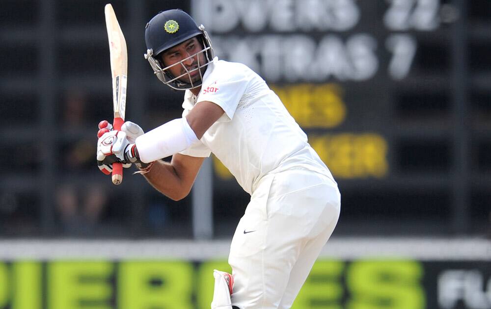 India’s Cheteshwar Pujara turns the ball down leg against New Zealand XI on the second day of a pre test warm up cricket match at Cobham Oval in Whangarei, New Zealand.