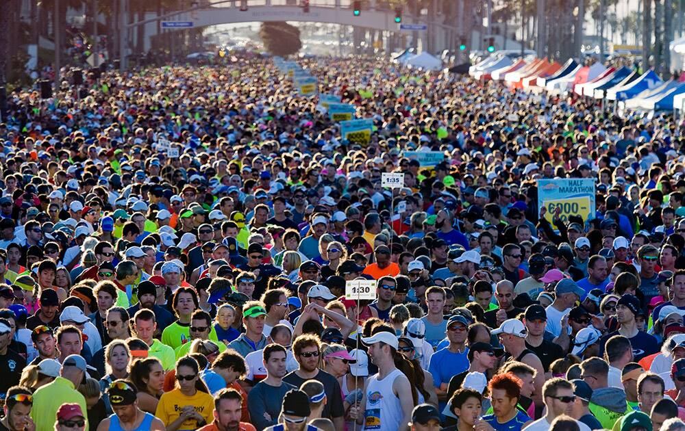 Runners are shown on Pacific Coast Highway while they wait to get started at the Surf City Marathon/Half Marathon in Huntington Beach, Calif.
