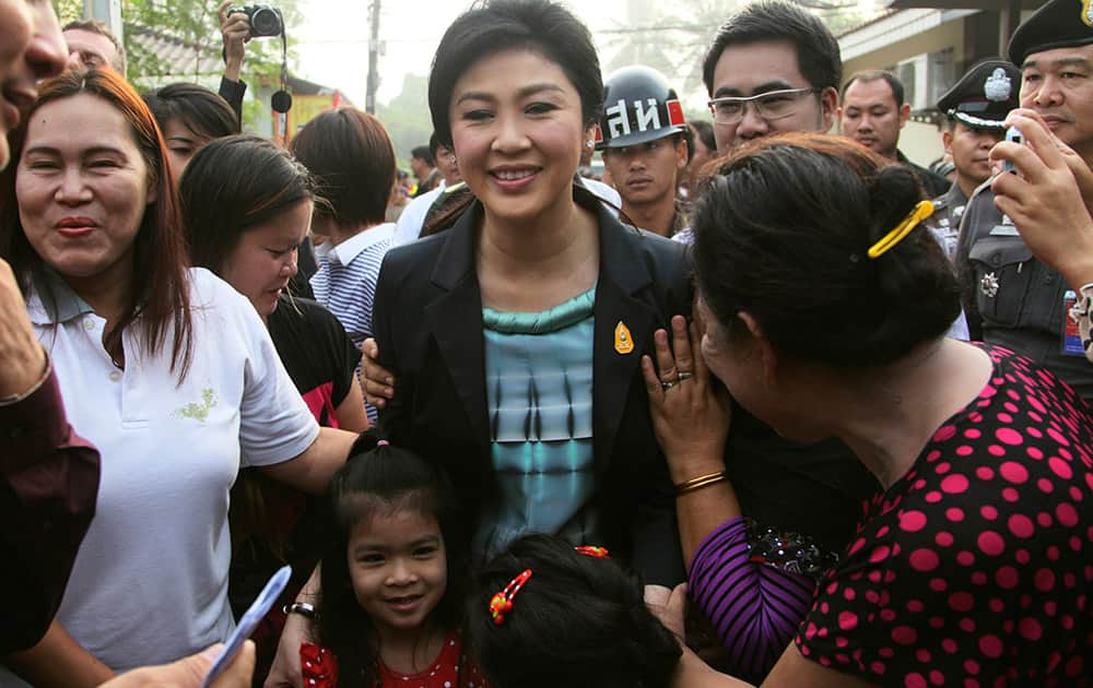 Thai Prime Minister Yingluck Shinawatra arrives to cast her ballot for the general election at a polling station in Bangkok, Thailand.