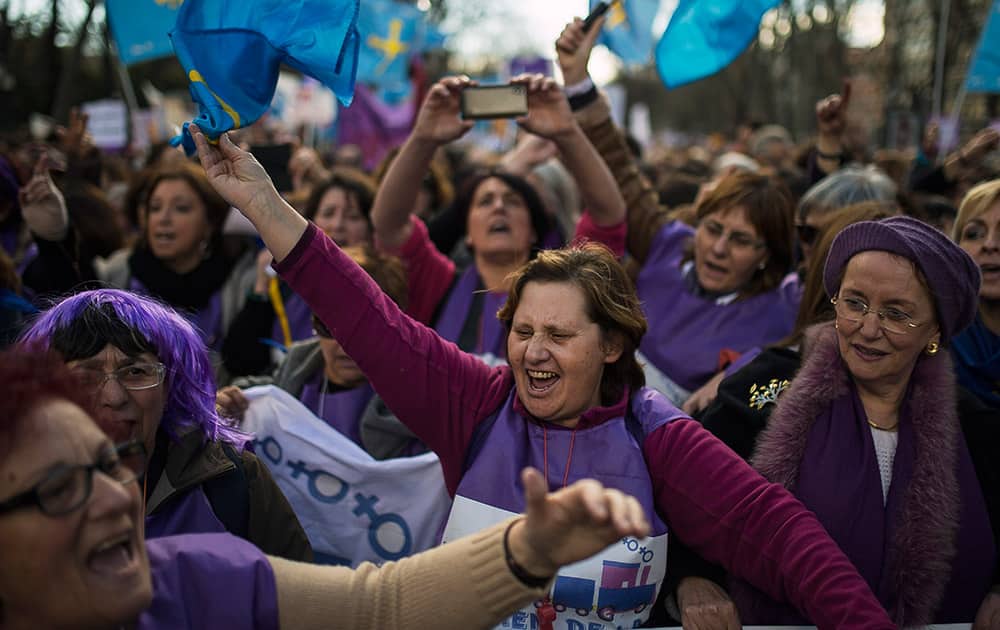 Protesters shout slogans as they march towards the Spanish Parliament during a protest against government`s plan to implement major restrictions on abortion in Madrid, Spain.