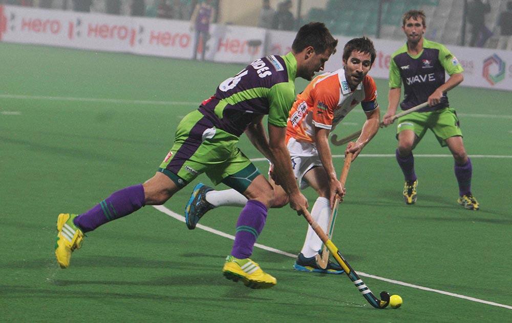 Matt Gohdes of Delhi Wave Riders in action against Kalinga Lancers during the Hero Hockey India league match in New Delhi.
