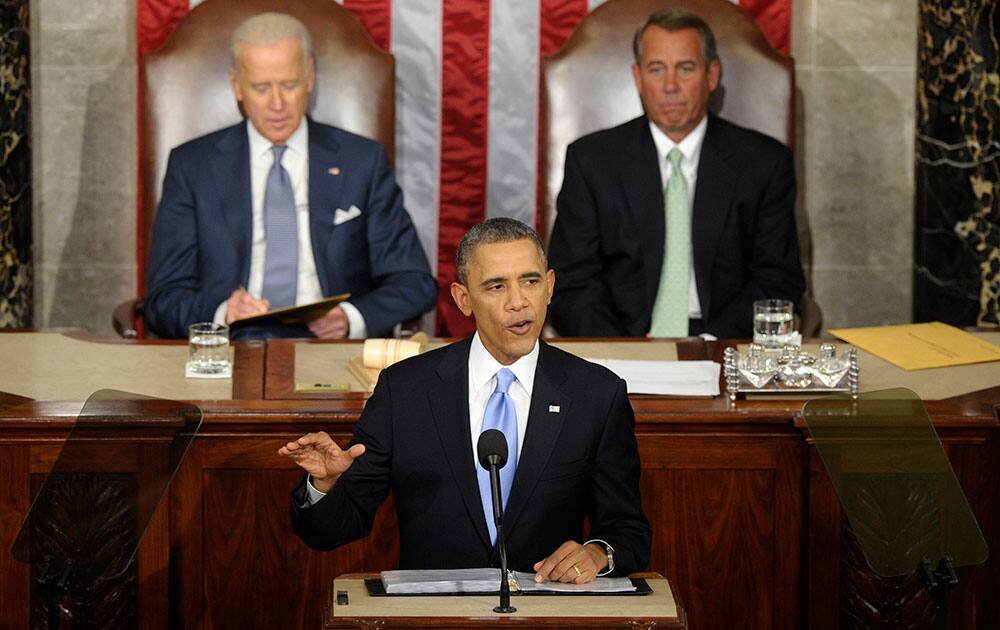 Vice President Joe Biden and House Speaker John Boehner of Ohio listen as President Barack Obama gives his State of the Union address on Capitol Hill in Washington.