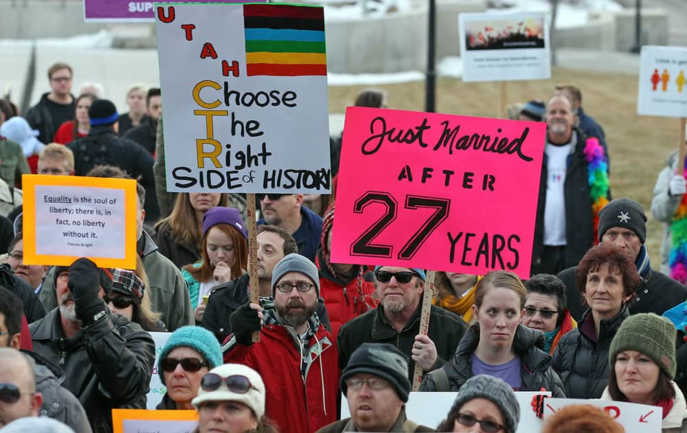 Supporters of gay marriage gather for a rally at the Utah State Capitol, Tuesday, Jan. 28, 2014, in Salt Lake City. Opponents and supporters of gay marriage held twin rallies at the Capitol.