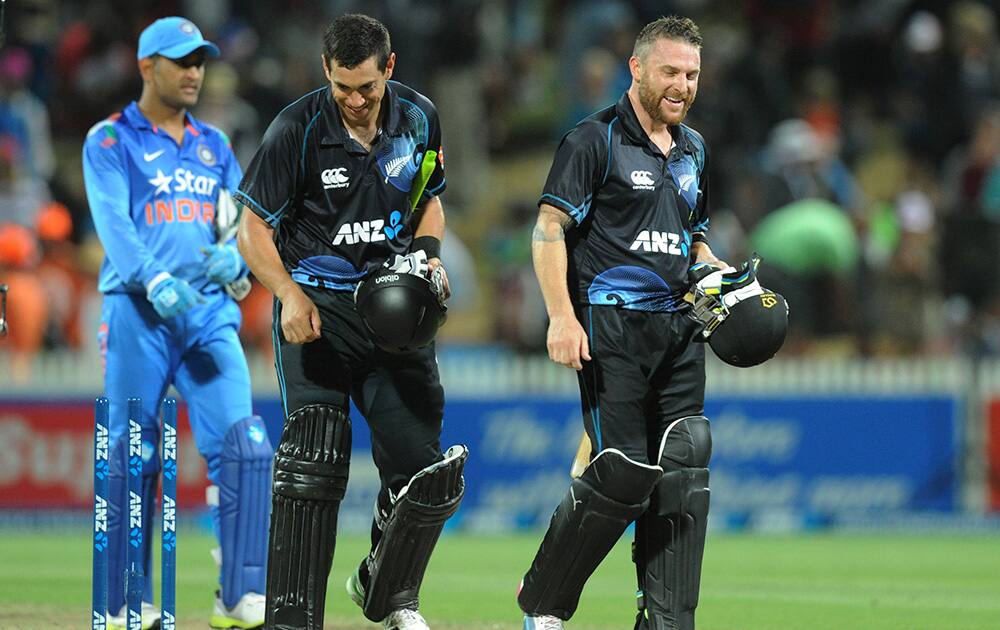 New Zealand`s Ross Taylor, center, and Brendon McCullum, right, walk together after their series win over India in the fourth one day International cricket match at Seddon Park in Hamilton, New Zealand.