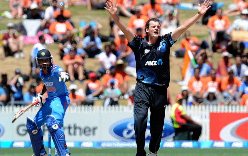 New Zealand’s Kyle Mills, right, appeals unsuccessfully for the wicket of India’s Virat Kohli in the fourth one-day international cricket match at Seddon Park in Auckland.