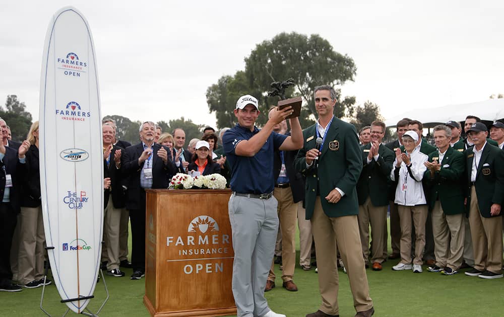 Scott Stallings holds the trophy after winning the Farmers Insurance Open golf tournament in San Diego.
