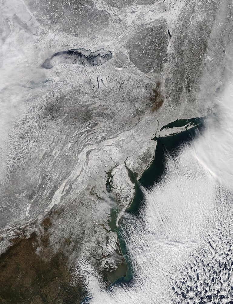 This image provided by NASA shows the snow across the northeastern US taken by NASA`s Aqua satellite.
