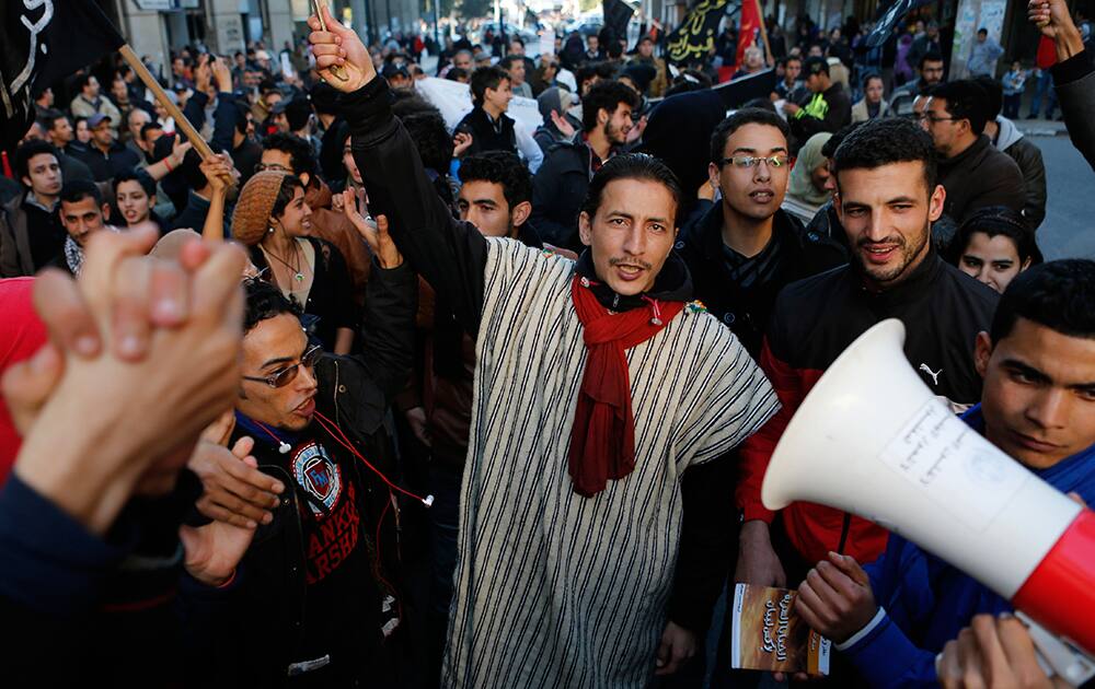 Anti-government protesters from the `20th February, the Moroccan Arab Spring Movement`, shout during a rally in Rabat, Morocco.