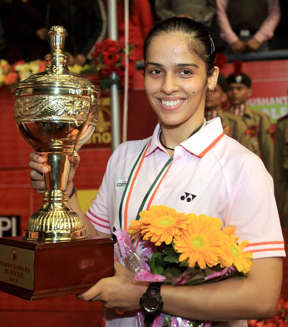 Saina Nehwal with winning trophy in the women title of Syed Modi international India Grand Prix Gold Badminton Championship at BBD Badminton Academy in Lucknow.
