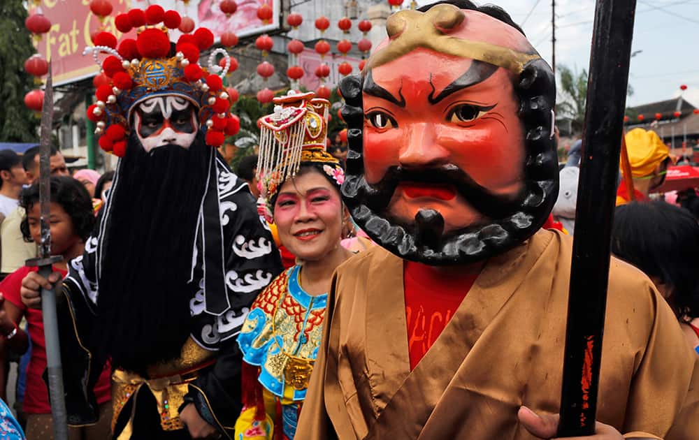 Participants dressed as Chinese gods take part in a traditional parade called `Grebeg Sudiro` to celebrate the upcoming Chinese New Year at the China town in Solo, Central Java, Indonesia.
