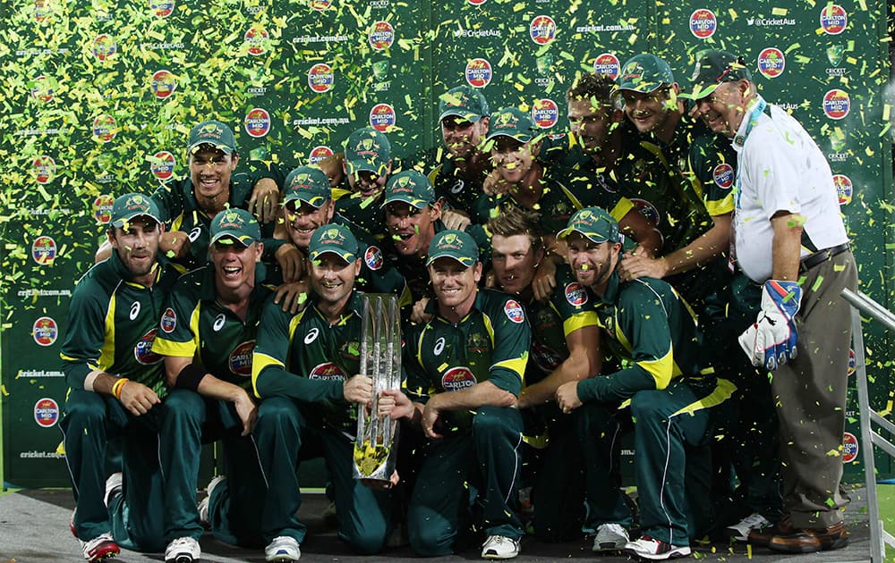 The Australian team members celebrate winning the series during their One Day International cricket match against England in Adelaide.