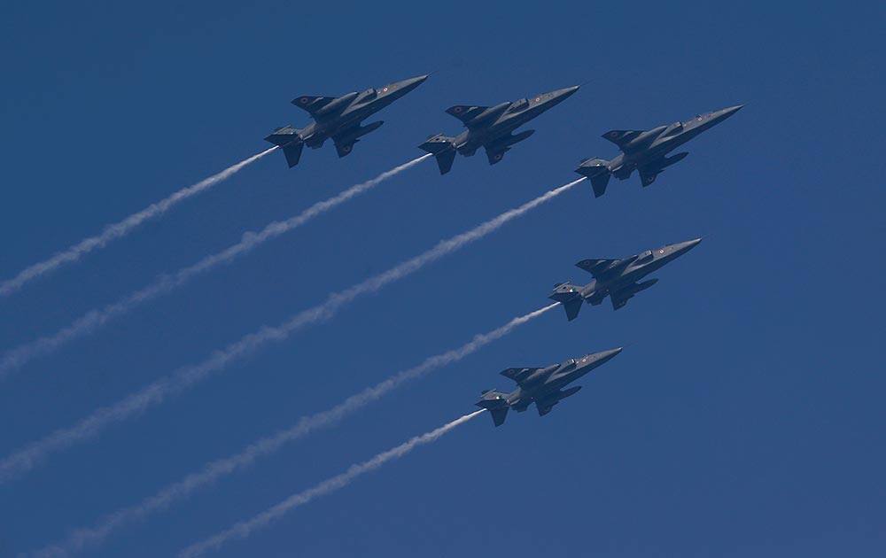 Indian Air Force fighter planes fly over Rajpath, the ceremonial boulevard during the Republic Day parade in New Delhi.