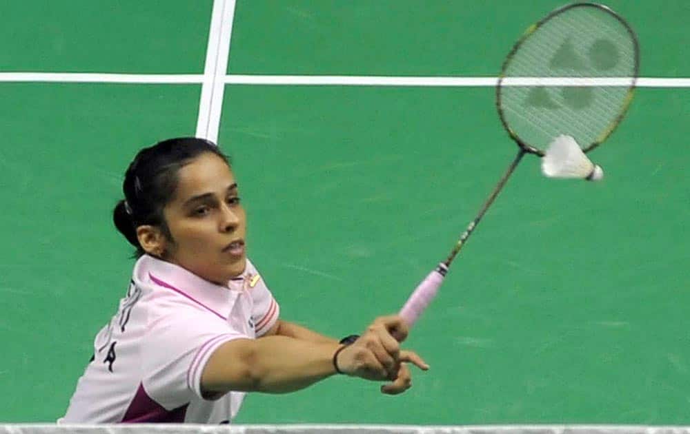 Saina Nehwal in action against Xuan Deng of China during their semi-final of the Syed Modi Inaternational Grand Prix Gold badminton Championship in Lucknow.
