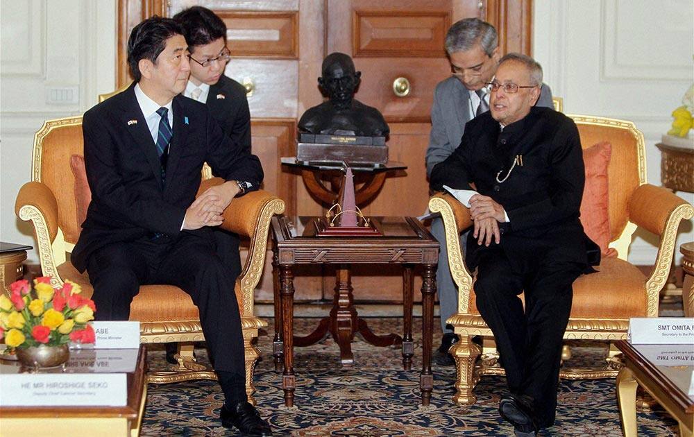 President Pranab Mukherjee with Japanese Prime Minister Shinzo Abe during a meeting at the Rashtrapati Bhavan in New Delhi.