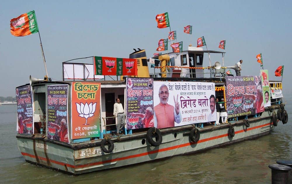 BJP activists campaign on River Ganges in Kolkata on Saturday for the upcoming Kolkata rally of BJP Prime Ministerial candidate Narendra Modi.