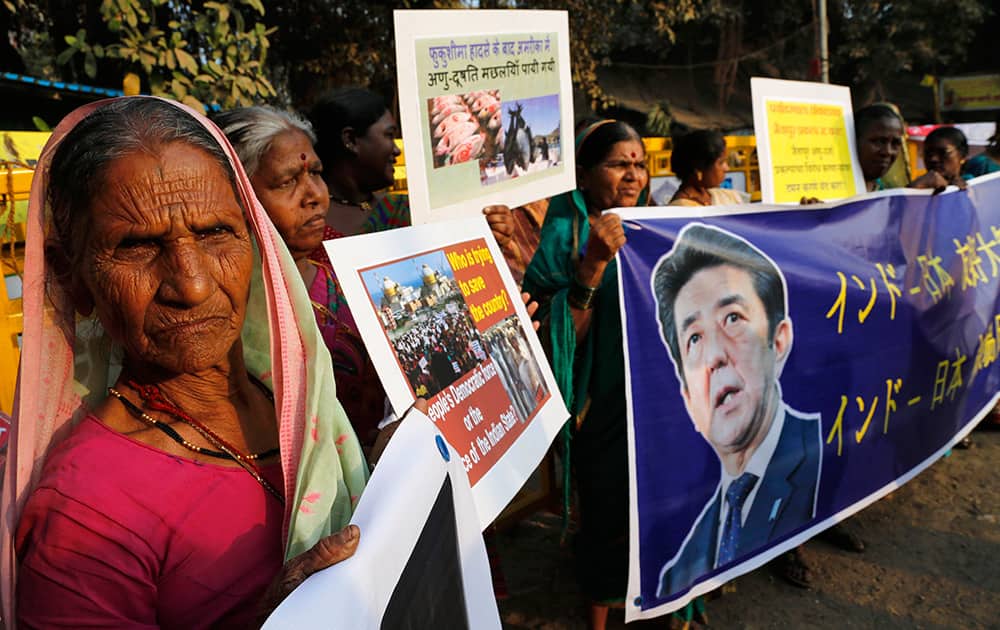 Anti-nuclear activists hold a banner and protest against the visit of Japanese Prime Minister Shinzo Abe in Mumbai. Abe is arriving Saturday on a three-day official visit to India and will also be the chief guest on India’s Republic Day parade, celebrated on Jan. 26.
