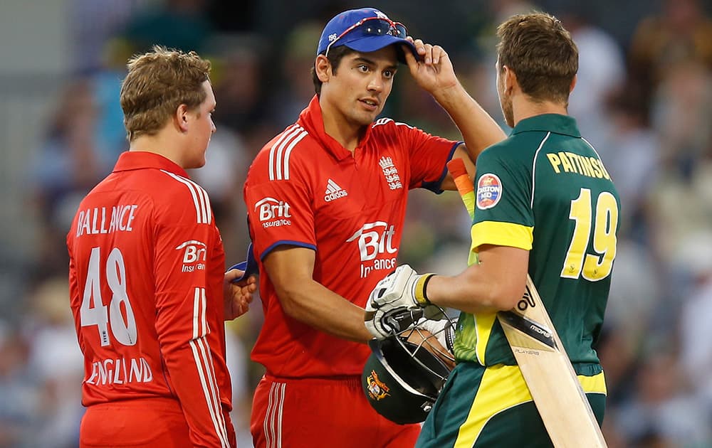 England`s Alastair Cook is congratulated by Australia`s James Pattinson on completion of their one day international cricket match in Perth, Australia. England defeated Australia by 57 runs.