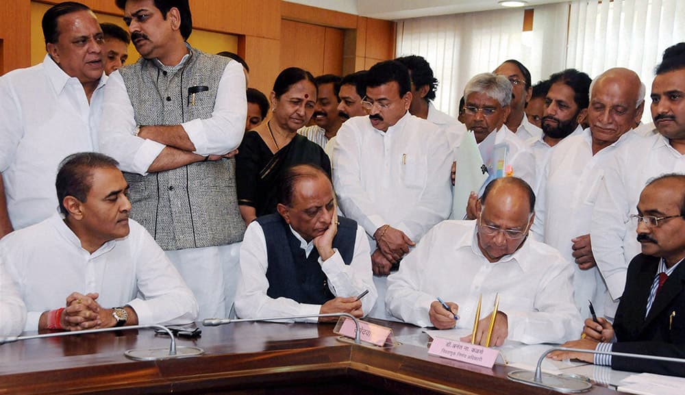 NCP President and Union Agriculture Minister Sharad Pawar (R), with party leaders, filing his nomination papers for Rajya Sabha at Vidhan Bhavan in south Mumbai.