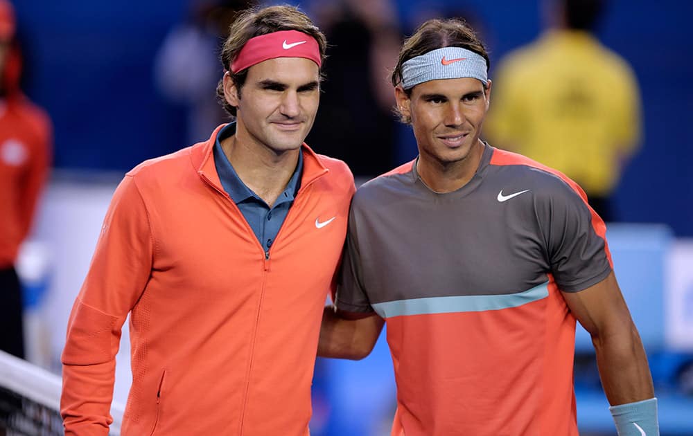 Rafael Nadal of Spain, right, and Roger Federer of Switzerland pose at the net before their semifinal at the Australian Open tennis championship in Melbourne, Australia.