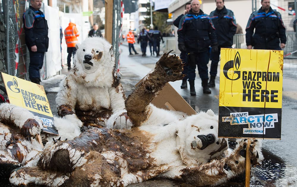 Greenpeace activists dressed as a polar bears demonstrate against Gazprom at the 44th Annual Meeting of the World Economic Forum, WEF, in Davos, Switzerland.
