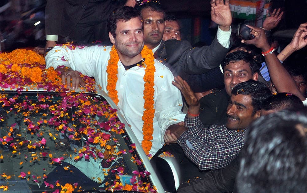 Congress Vice President Rahul Gandhi is garlanded by supporters during 2nd day of his visit to Amethi.