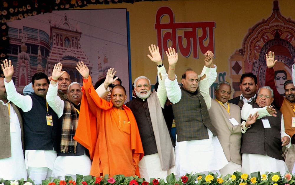 BJP Prime Ministerial candidate Narendra Modi with party President Rajnath Singh, Kalyan Singh and MPs Yogi Adityanath and Kalraj Mishra waves at crowd during a rally at Gorakhpur in Uttar Pradesh.