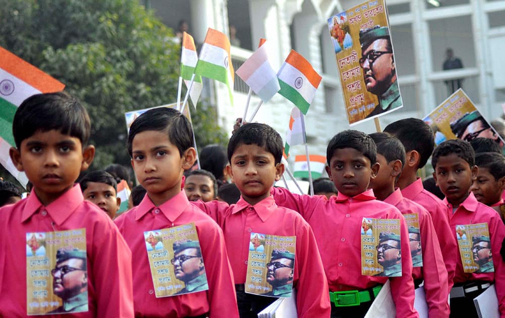 School children during a procession to mark the 118th birth anniversary of Subash Chandra Bose in Agartala.