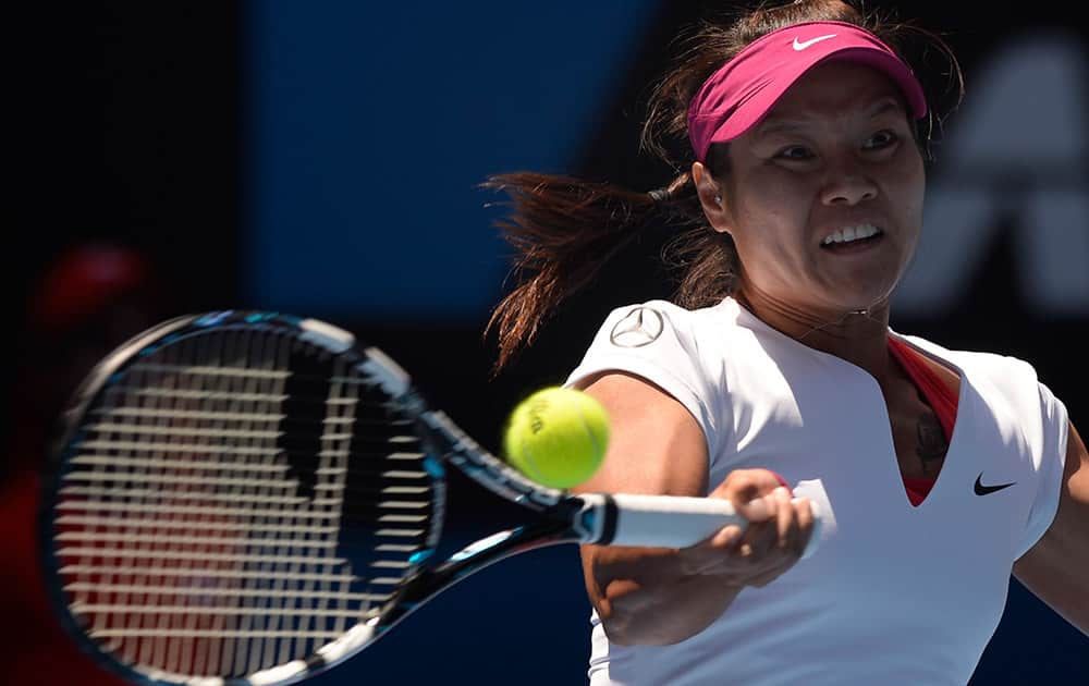 Li Na of China makes a forehand return to Eugenie Bouchard of Canada during their semifinal at the Australian Open tennis championship in Melbourne, Australia.