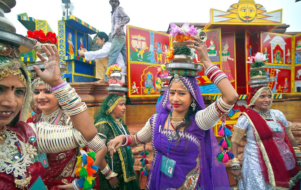 Women from the western Indian state of Rajasthan perform a dance during a press preview of tableaux displaying a glimpse of culture from different parts of India, in New Delhi.