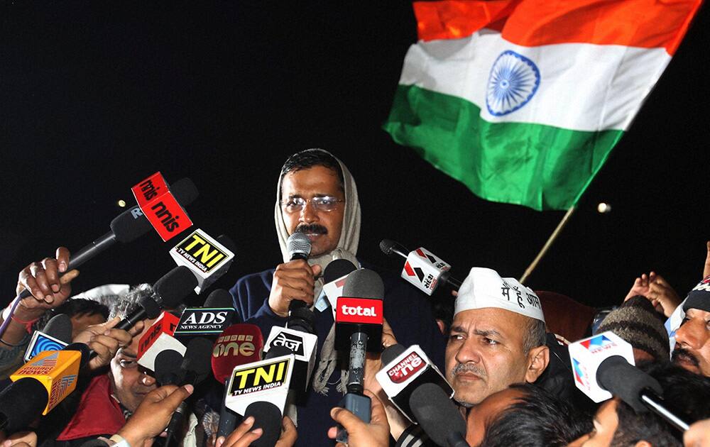 Delhi Chief Minister Arvind Kejriwal with Education Minister Manish Sisodia announces the end of his dharna against the police after L-G`s assurance to partially meet his demands, in New Delhi.