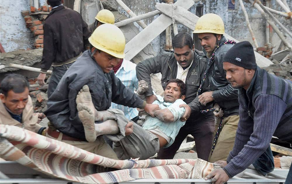 Rescue workers trying to save a labourer after an under-construction building collapsed in Beawar, Rajasthan.