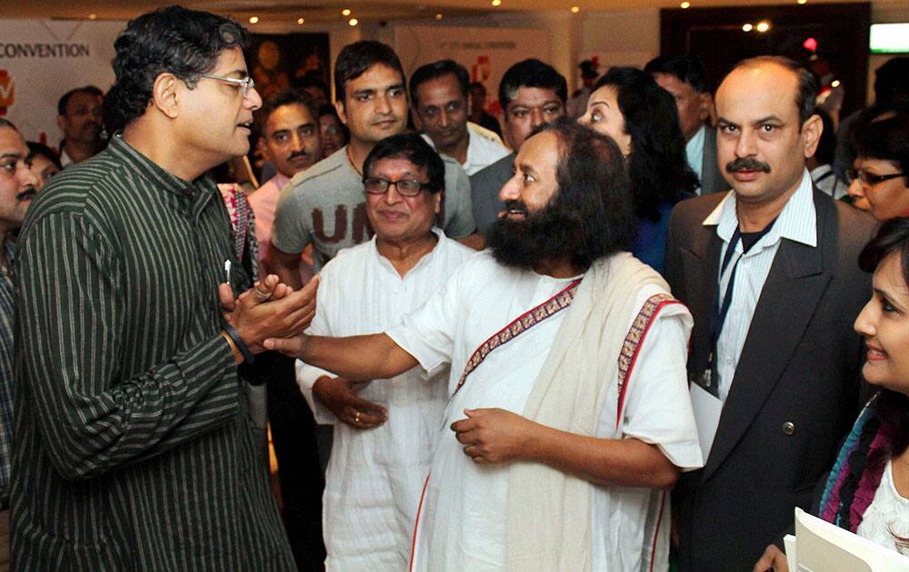 Sri Sri Ravi Shankar, founder of Art of Living Foundation, with BJD Rajya Sabha MP Baijyant Panda after an annual convention in Bhubaneswar.