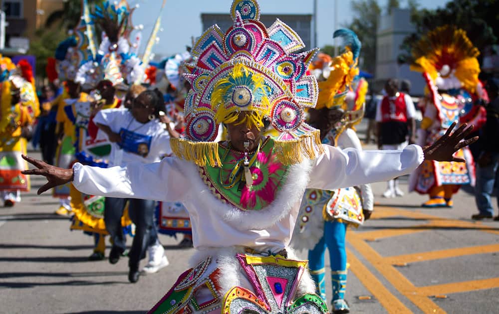 A member of a Caribbean carnival dance group marches in the MLK parade in Miami. Dr. Martin Luther King, Jr. is honored across the country annually on the third Monday in January with Martin Luther King, Jr. Day. He was the most visible figure in the Civil Rights movement.