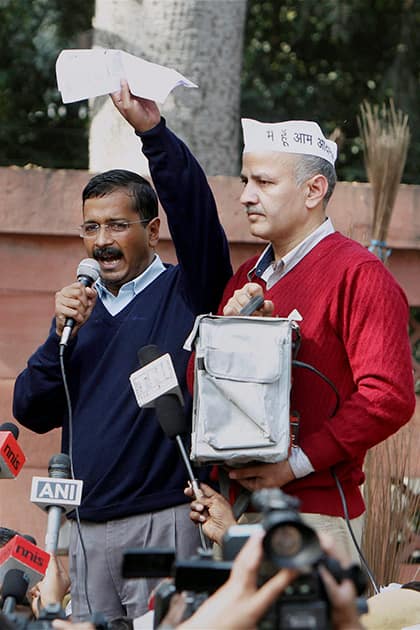 Delhi Chief Minister Arvind Kejriwal with his cabinet colleague Manish Sisodia during a dharna demanding action against police personnel for alleged dereliction of duty at Raisina Road, near Rail Bhavan in New Delhi.