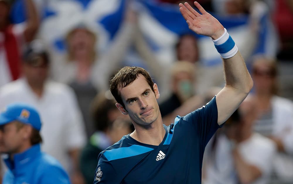 Andy Murray of Britain waves to the crowd after defeating Stephane Robert of France in their fourth round match at the Australian Open tennis championship in Melbourne, Australia.