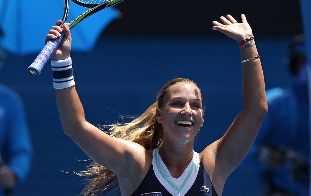 Dominika Cibulkova of Slovakia celebrates her win over Maria Sharapova of Russia during their fourth round match at the Australian Open tennis championship in Melbourne.