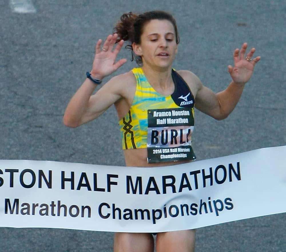 Serena Burla is the first woman to cross the finish line to win the USATF Houston Half Marathon championship at the Houston Half Marathon, in Houston.