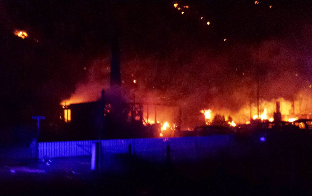 Flames destroy houses in the village of Laerdal, Norway. Officials say a large fire has blazed through a historical village famous for its well-preserved wooden houses from the 18th and 19th centuries, destroying at least 23 buildings.
