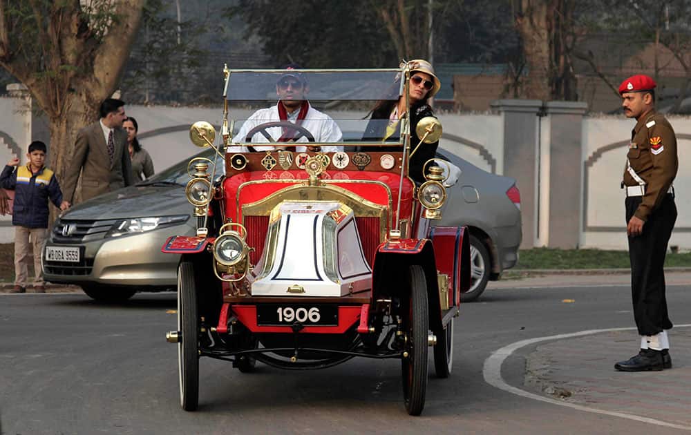 An owner drives a 1906 Renault Freres, powered with two cylinders and an eight horsepower engine, as he arrives to take part in the Statesman vintage and classic car rally in Kolkata.