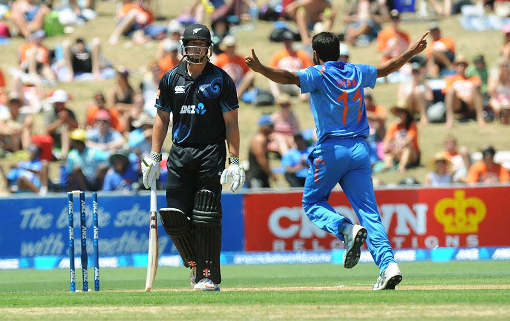 India’s Mohammed Shami celebrates after bowling New Zealand`s Jessie Ryder for 18 during their first one-day international cricket match, at McLean Park, in Napier, New Zealand.