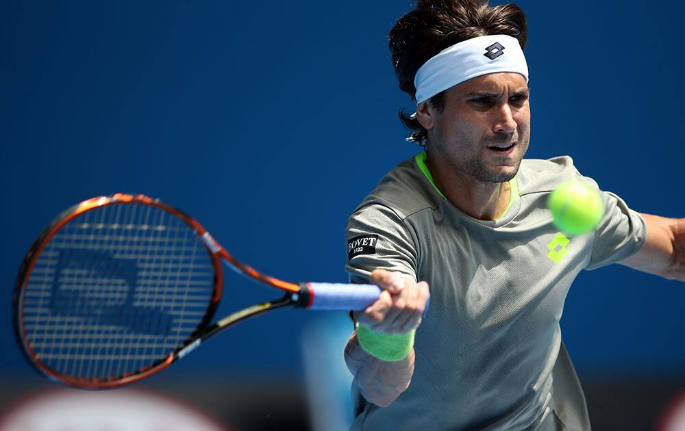 David Ferrer of Spain makes a forehand return to Florian Mayer of Germany during their fourth round match at the Australian Open tennis championship in Melbourne.