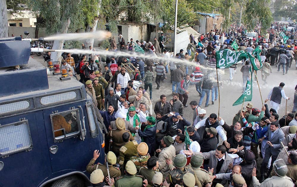 Police use water cannons to disperse PDP activists over holding a protest against state government in Jammu.