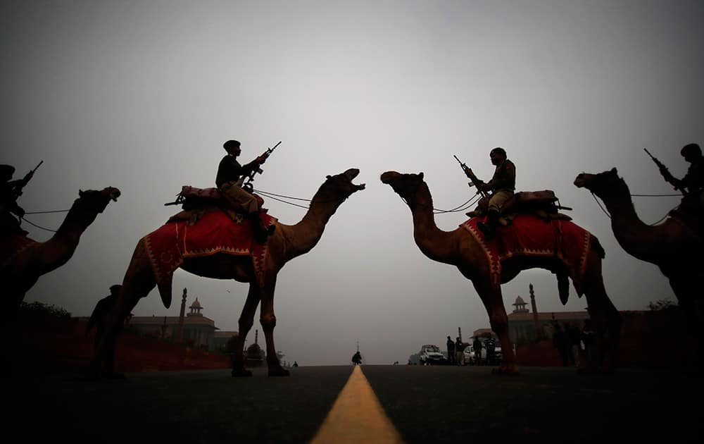 Camel mounted soldiers stand in formation during a rehearsal of the Beating Retreat ceremony at Raisina hill in New Delhi.