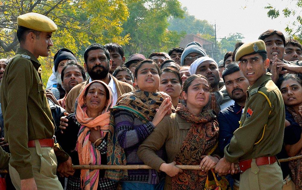 Police stops Asaram supporters outside Session Court where he was being produced in connection with a sexual assault case, in Jodhpur.