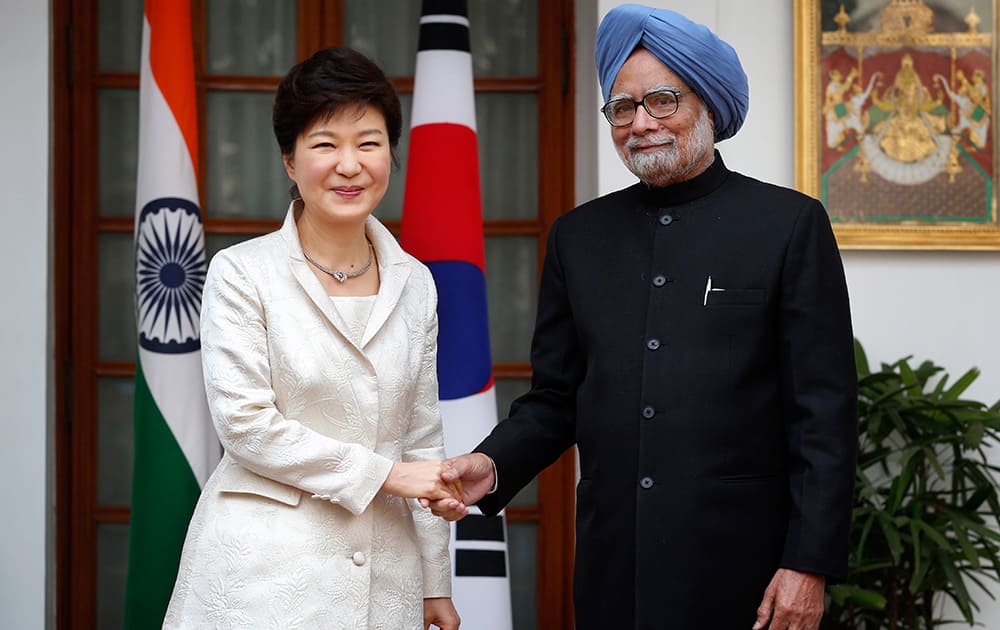 South Korean President Park Geun-hye and Indian Prime Minister Manmohan Singh pose for photos before their talks in New Delhi. Park is on a four-day state visit to India.