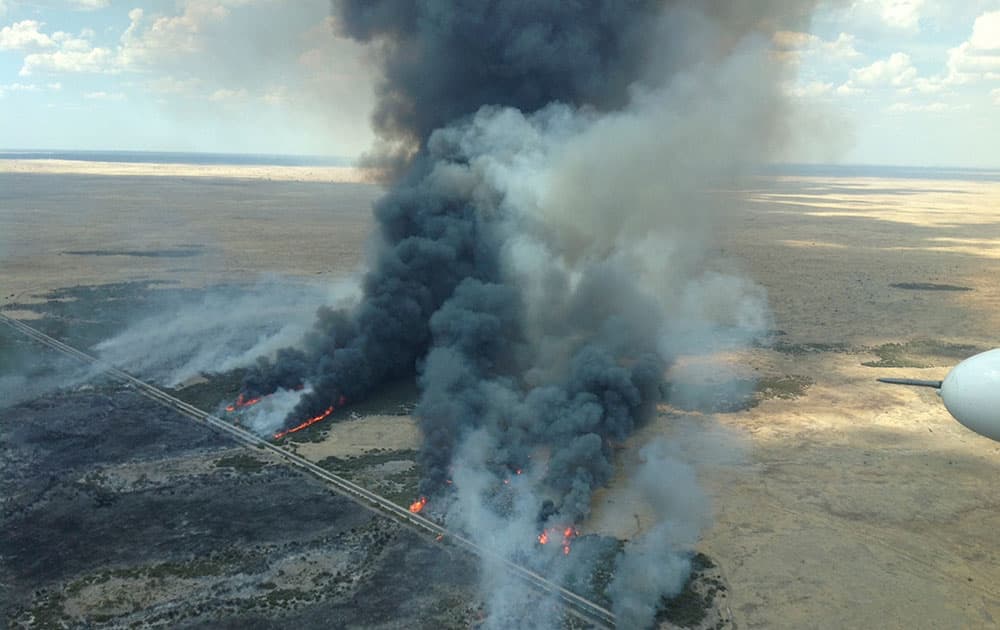 Aerial photo supplied by South Australian Country Fire Service, a large fire burns in Kiana in the State’s Lower Eyre Peninsula, Australia.