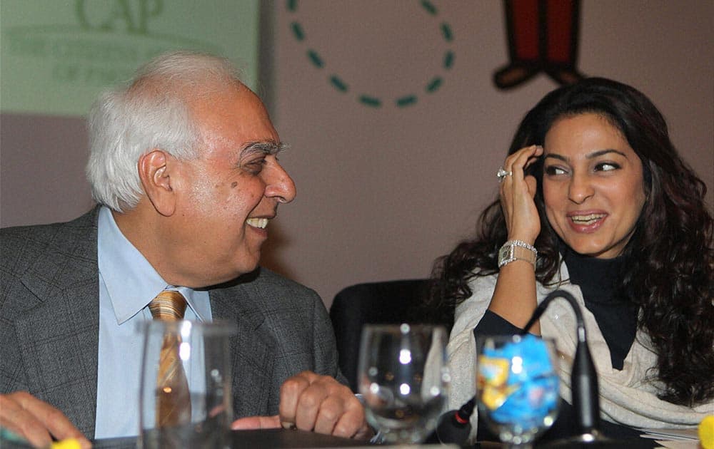 Union Minister for Communications & IT, Kapil Sibal with actress Juhi Chawla during the launch of `Exchange for Change` program to unite Indian & Pakistani school children in New Delhi.